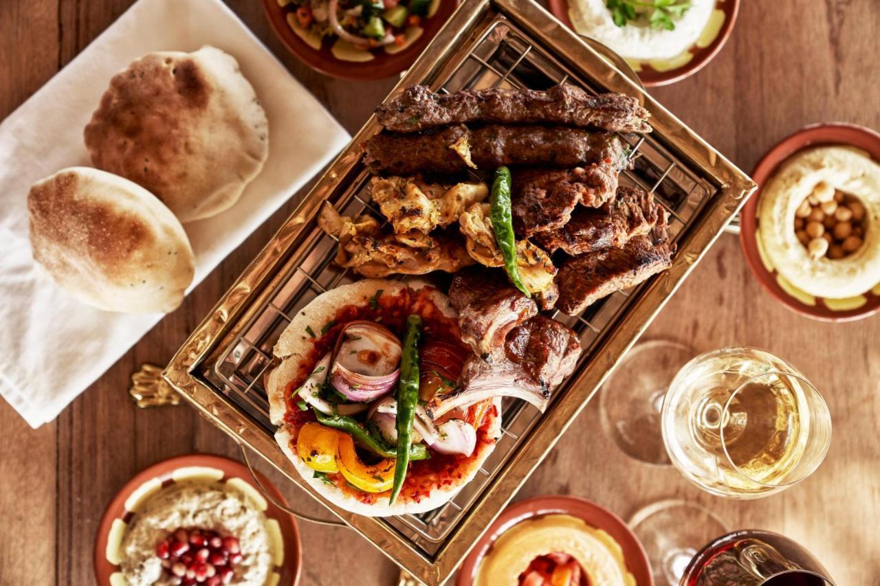 Fanar Hotel & Residences Salála Exteriér fotografie A selection of Middle Eastern cuisine